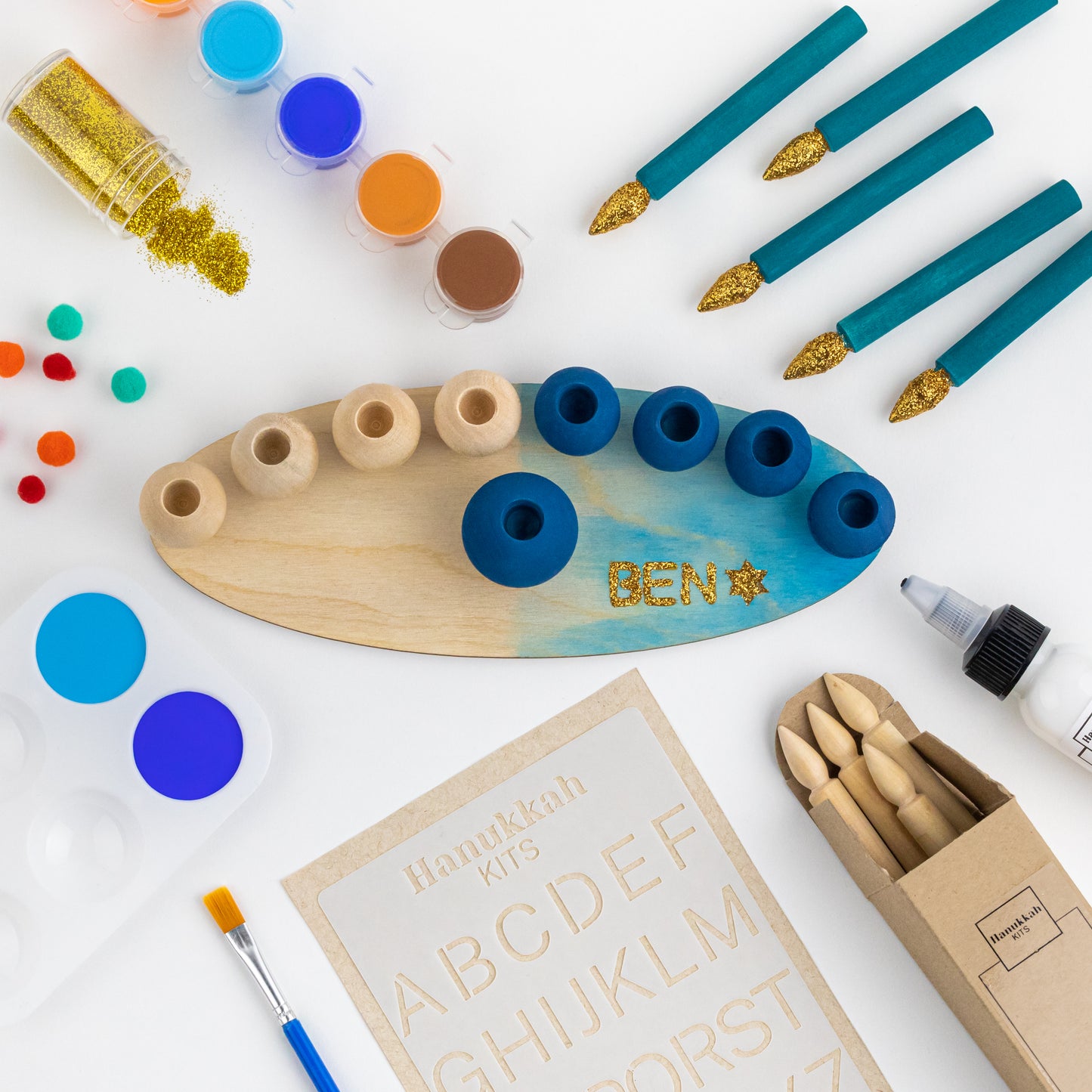 "My DIY Menorah Kit: Unveiling the Contents Within. ALT: Inside view of the kit's box, showcasing components for crafting a personalized menorah this Hanukkah."